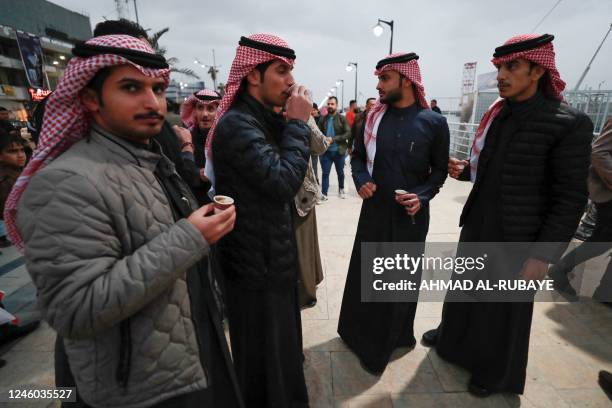 Kuwaiti football fans drink coffee in the Al-Ashar district of Iraq's southern city of Basra on January 5 ahead of the 25th Arabian Gulf Cup football...