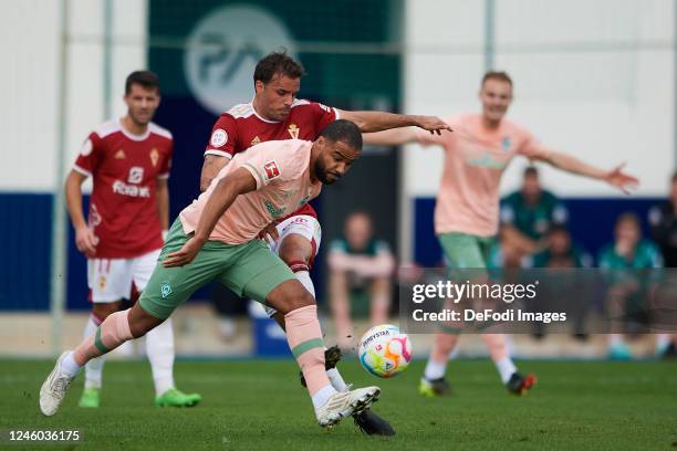 Manuel Mbom of SV Werder Bremen and Pedro Leon of Real Murcia battle for the ball during the Friendly match between Real Murcia and Werder Bremen at...