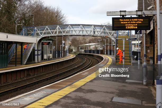 Sign reading "This Station Is Closed Today Because Of Strike Action" on a platform at Bat and Ball railway station, closed due to strike action by...