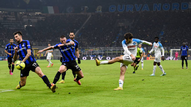 Khvicha Kvaratskhelia of SSC Napoli fires a shot past Milan Skriniar and Francesco Acerbi of FC Internazionale during the Serie A football match...