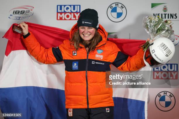 January 2023, North Rhine-Westphalia, Winterberg: Skeleton: World Cup, single, women, 2nd run: Kimberley Bos from the Netherlands is happy about her...
