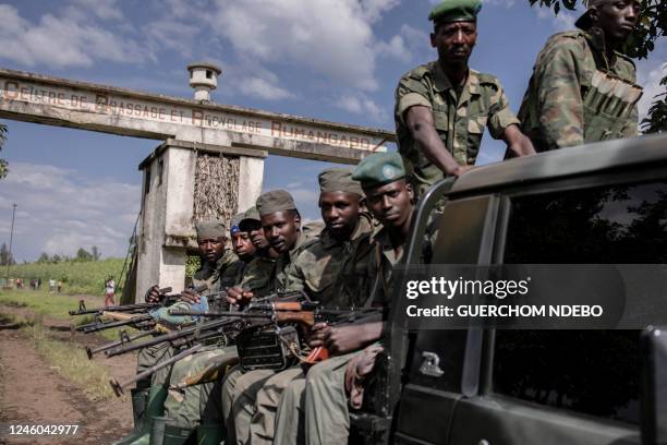 Soldiers leave leave Rumangabo camp after the meeting between EACRF officials and M23 rebels during the handover ceremony at Rumangabo camp in...