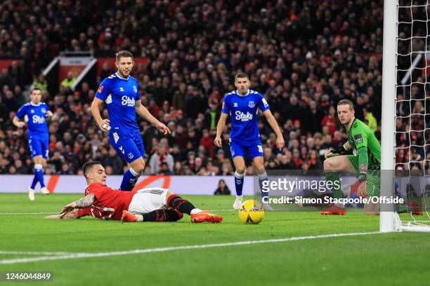 Antony of Manchester United scores the opening goal during the Emirates FA Cup Third Round match between Manchester United and Everton at Old...