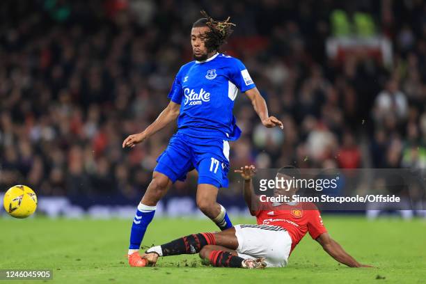 Tyrell Malacia of Manchester United takes out the standing leg of Alex Iwobi of Everton during the Emirates FA Cup Third Round match between...