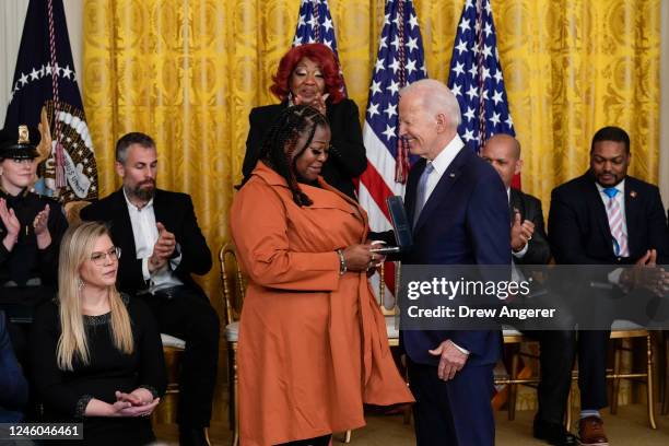 President Joe Biden presents a Presidential Citizens Medal to Georgia poll worker Shaye Moss during a ceremony to mark the two-year anniversary of...