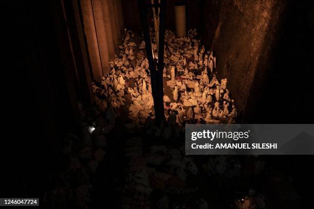 Ethiopian Orthodox Church believers are seen inside Biete Medhane Alem Orthodox church in Lalibela, on January 6, 2023. - The Ethiopian Christmas...