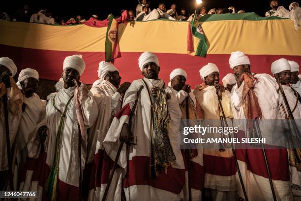 Ethiopian Orthodox priests stand to sing at Saint Mary's Church in Lalibela, on January 6, 2023. - The Ethiopian Christmas also called 'Gena' in...