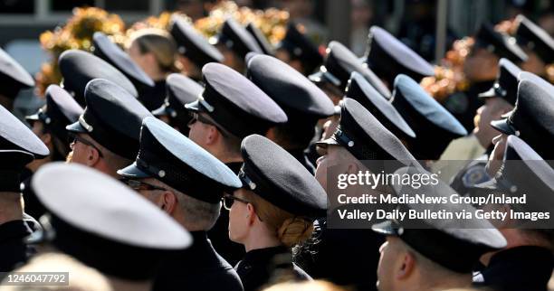 Riverside, CA An overflow crowd of hundreds of members of law enforcement, some as far away as New York and Chicago, watch on a big screen at funeral...