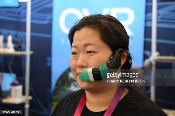 Sarah Socia, of OVR Technology, models the ION 3, a wearable scent technology which delivers olfactory smells which correlate with items a user...