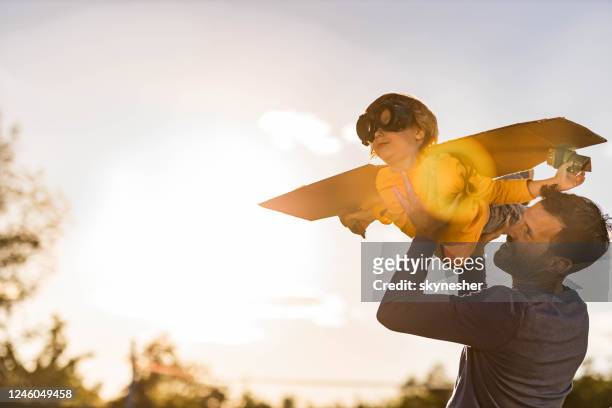 daddy, i'm an airplane! - family with one child stock pictures, royalty-free photos & images
