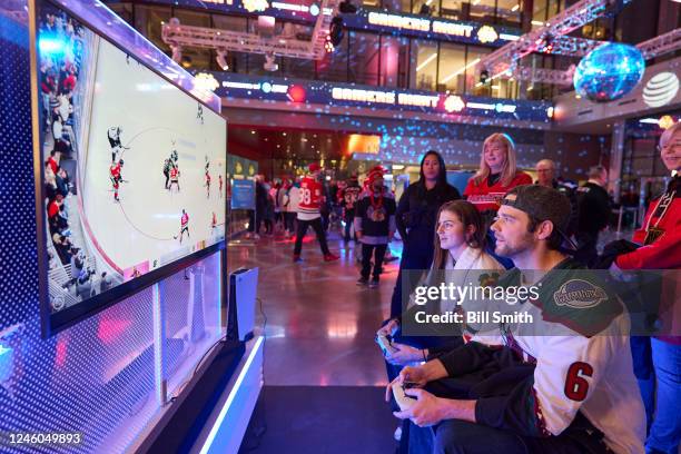 Chicago Blackhawks and Arizona Coyotes fans play NHL video games before the game at United Center on January 06, 2023 in Chicago, Illinois.