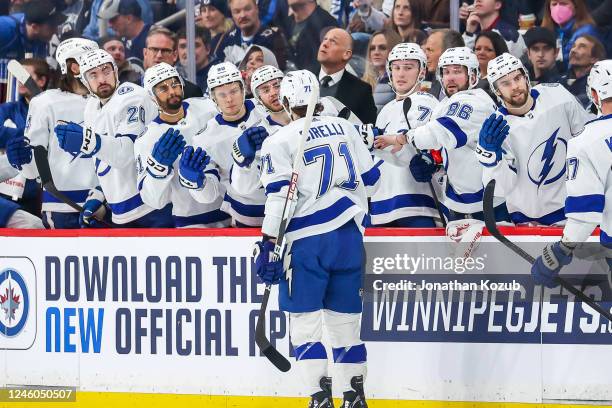 Anthony Cirelli of the Tampa Bay Lightning celebrates his first period goal against the Winnipeg Jets with teammates at the bench at the Canada Life...