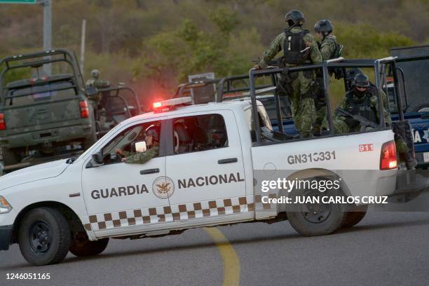 Members of the national guards and Mexican army drive on a road a day after an operation to arrest the son of Joaquin "El Chapo" Guzman, Ovidio...