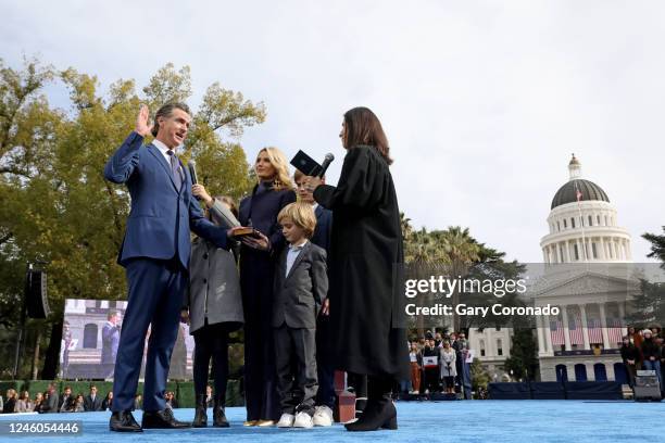 Gov. Gavin Newsom, shown with wife Jennifer Lynn Siebel Newsom and children; Brooklynn, Dutch and Hunter, takes the oath of office sworn in by Chief...