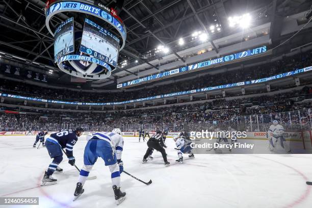 Winnipeg Jets and Tampa Bay Lightning players get set to take a first period face-off at the Canada Life Centre on January 6, 2023 in Winnipeg,...