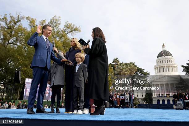 Gov. Gavin Newsom, shown with wife Jennifer Lynn Siebel Newsom and children; Brooklynn and Dutch, takes the oath of office sworn in by Chief Justice...