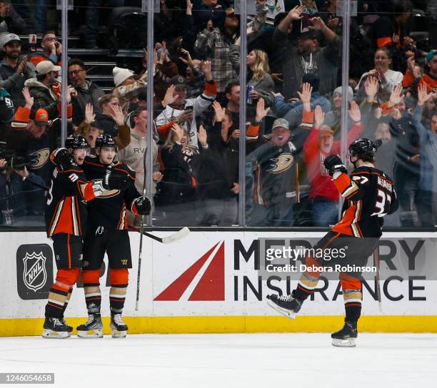 John Klingberg of the Anaheim Ducks celebrates his game winning goal with teammates during overtime against the San Jose Sharks at Honda Center on...