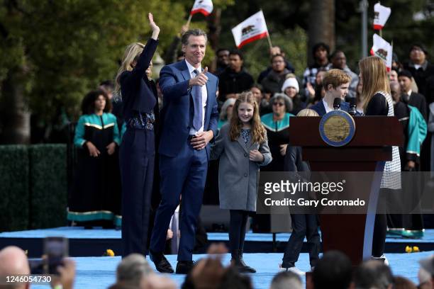 Gov. Gavin Newsom gives a thumbs up to the crowd, shown with wife Jennifer Lynn Siebel Newsom and children; Brooklynn, Dutch, Hunter, and Montana at...