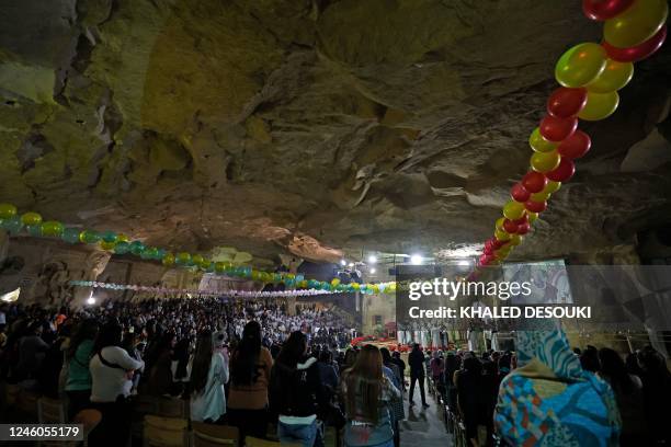 Egyptian Copts attend the Christmas mass at the Saint Simon Monastery, also known as the Cave Church, in the Mokattam mountain of Egypt's capital...