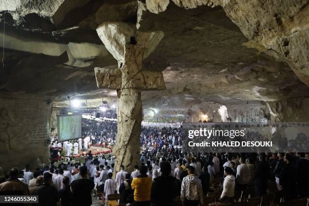 Egyptian Copts attend the Christmas mass at the Saint Simon Monastery, also known as the Cave Church, in the Mokattam mountain of Egypt's capital...