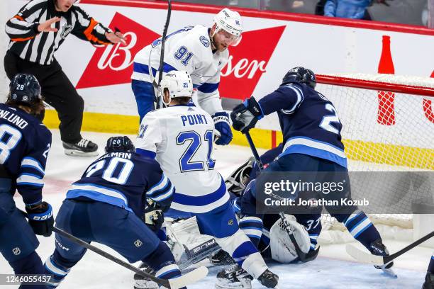 Dylan DeMelo of the Winnipeg Jets clears the puck off the goal-line during third period action against the Tampa Bay Lightning at the Canada Life...