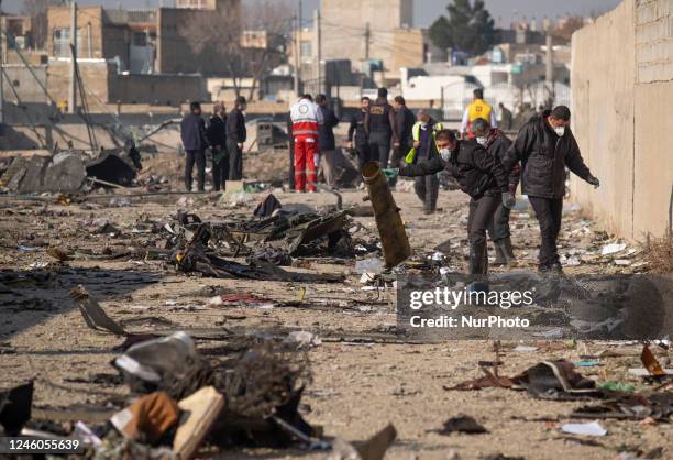 January 8, 2020 file photo shows, Policemen, officials and members of the Iranian Red Crescent work at the Ukrainian flight PS752 International...