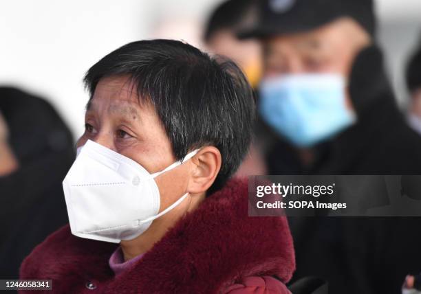 Female passenger wearing a mask waits to board a train at a train station waiting room. Around 6.3 million passenger trips are expected to be made...