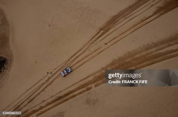 Audi's Swedish driver Mattias Ekstrom and his his Swedish co-driver Emil Bergkvist compete during Stage 7 of the Dakar 2023 between Riyadh and Al...