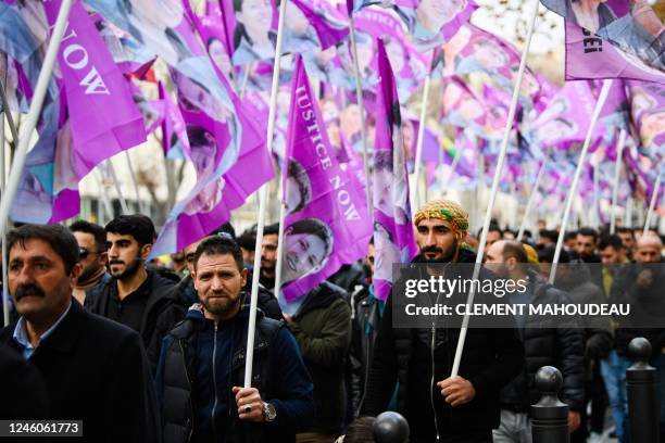 People take part in a tribute march in the memory of three Kurdish activists, who were murdered in January 2013, in Marseille, on January 7, 2023. -...