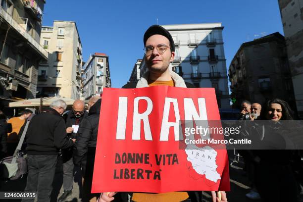 Man with a placard, during the protest and solidarity rally with the Iranian people "Women Life Freedom", against oppression and discrimination in...