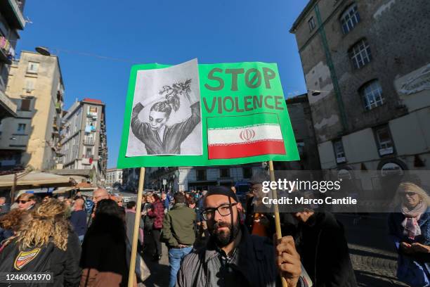 Man with a placard, during the protest and solidarity rally with the Iranian people "Women Life Freedom", against oppression and discrimination in...