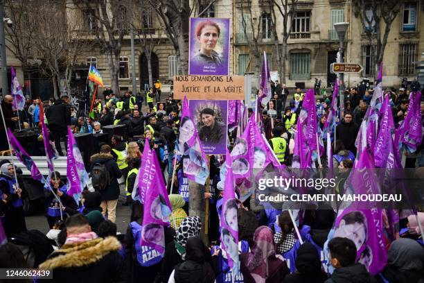 People take part in a tribute march in the memory of three Kurdish activists, who were murdered in January 2013, in Marseille, on January 7, 2023. -...