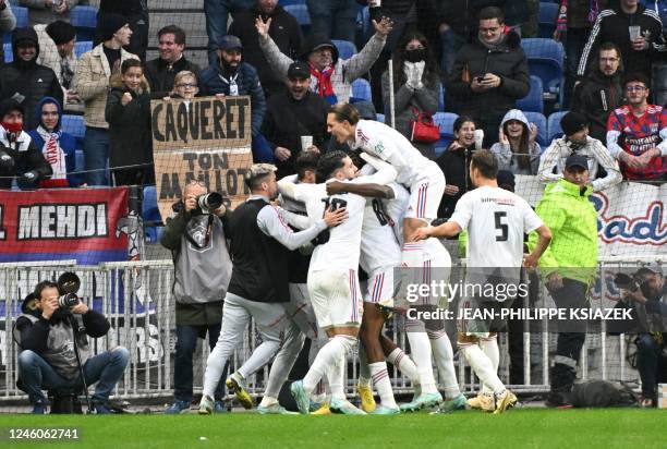 Lyons players celebrate after scoring the opening goal during the French Cup round of 64 football match between Olympique Lyonnais and FC Metz at the...