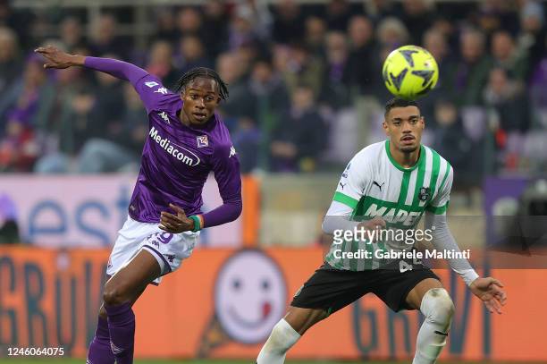 Christian Michael Kouakou Kouamé of ACF Fiorentina in action against Ruan Tressoldi of US Sassuolo during the Serie A match between ACF Fiorentina...