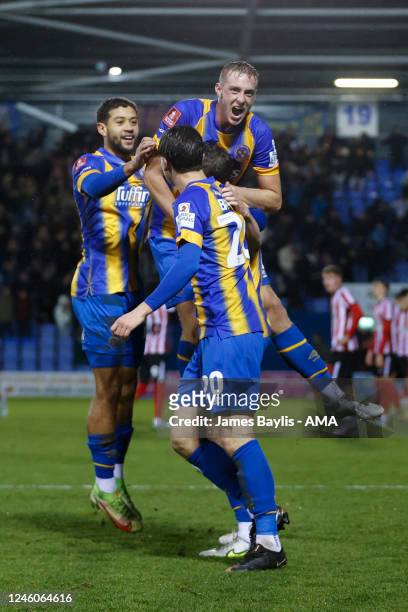 Matthew Pennington of Shrewsbury Town celebrates with his team mates after scoring a goal to make it 1-0 during the Emirates FA Cup Third Round match...