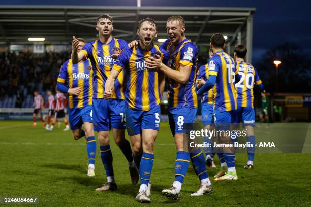 Matthew Pennington of Shrewsbury Town celebrates with his team mates after scoring a goal to make it 1-0 during the Emirates FA Cup Third Round match...