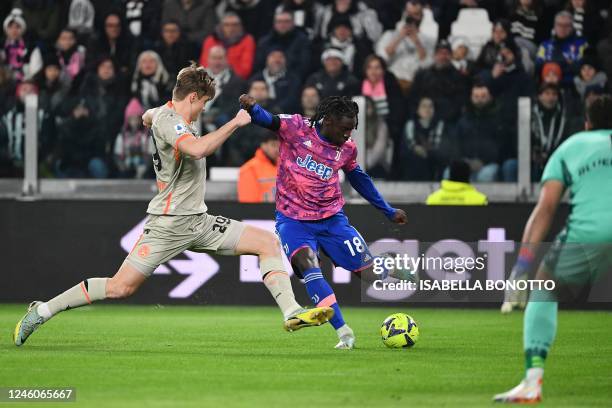 Juventus' Italian forward Moise Kean challenges Udinese's Slovenian defender Jaka Bijol during the Italian Serie A footbal match between Juventus and...