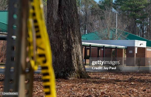 Police tape hangs from a sign post outside Richneck Elementary School following a shooting on January 7, 2023 in Newport News, Virginia. A 6-year-old...