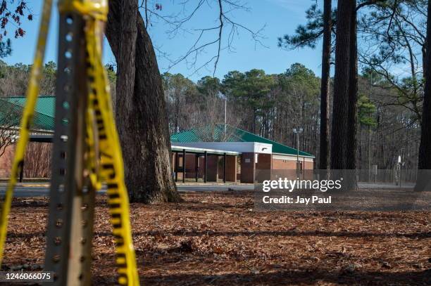 Police tape hangs from a sign post outside Richneck Elementary School following a shooting on January 7, 2023 in Newport News, Virginia. A 6-year-old...