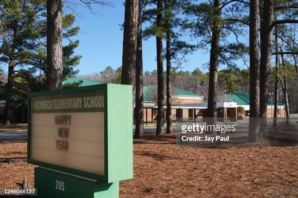 School sign wishing students a "Happy New Year" is seen outside Richneck Elementary School on January 7, 2023 in Newport News, Virginia. A 6-year-old...