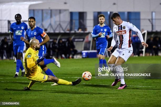Le Puy's French goalkeeper Jonathan Millieras fights for the ball with Nices English midfielder Ross Barkley during during the French Cup round of 64...