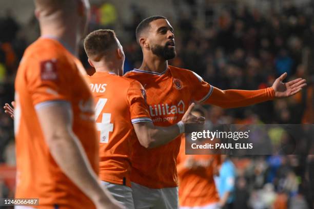 Blackpool's English midfielder CJ Hamilton celebrates after scoring their third goal during the English FA Cup third round football match between...