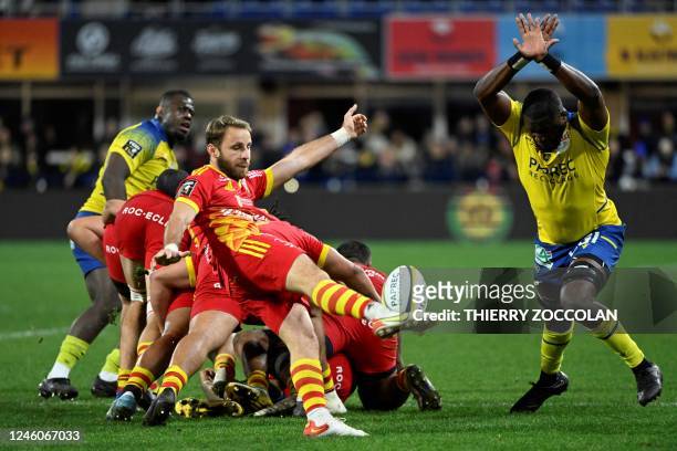 Perpignan's French scrum-half Tom Ecochard hits a box kick during the French Top14 rugby union match between ASM Clermont Auvergne and USA Perpignan...
