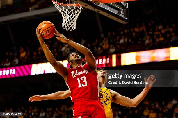 Derrick Walker of the Nebraska Cornhuskers goes up for a shot past Dawson Garcia of the Minnesota Golden Gophers in the second half of the game at...