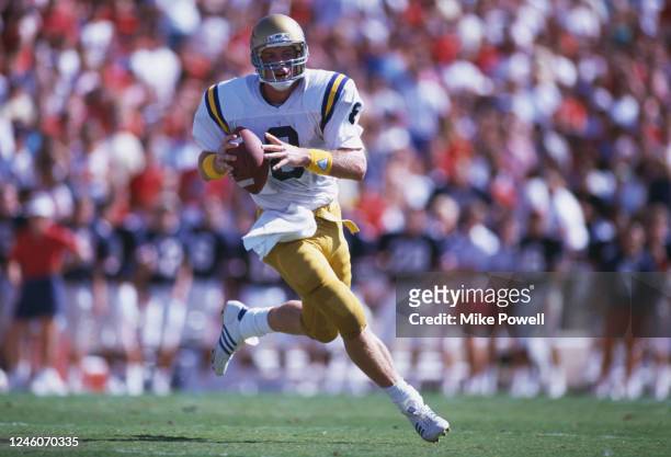 Troy Aikman, Quarterback for the University of California, Los Angeles UCLA Bruins runs the ball during the NCAA Pac-10 college football game against...