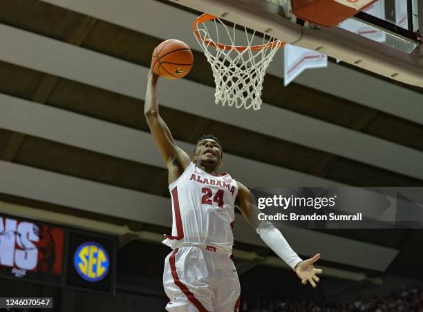 Brandon Miller of the Alabama Crimson Tide flies in for a slam dunk during the second period against the Kentucky Wildcats at Coleman Coliseum on...