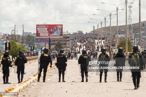 Supporters of ousted president Pedro Castillo clash with police forces in the Peruvian Andean city of Juliaca, on January 7, 2023. - Political...