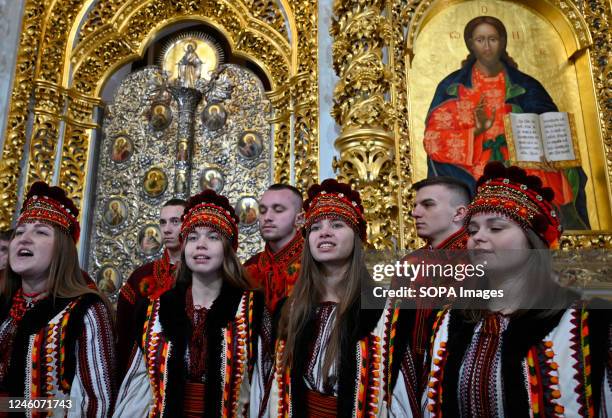 The choir sings during the Christmas service at the Assumption Cathedral of the Kyiv Pechersk Lavra in Kyiv amid the Russian invasion of Ukraine. At...