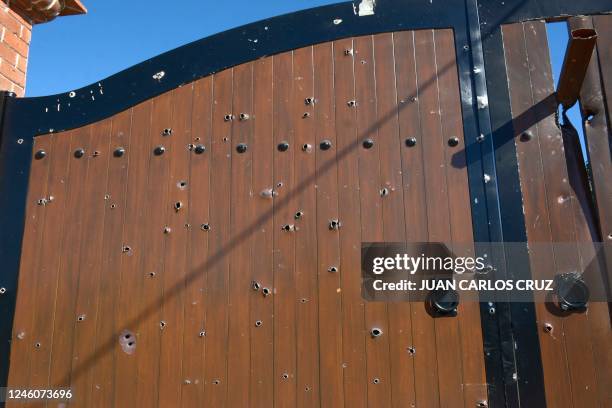 Picture of the bullet-riddled gate at the entrance of the mansion where Ovidio Guzman, aka "El Raton" , son of jailed drug trafficker Joaquin "El...