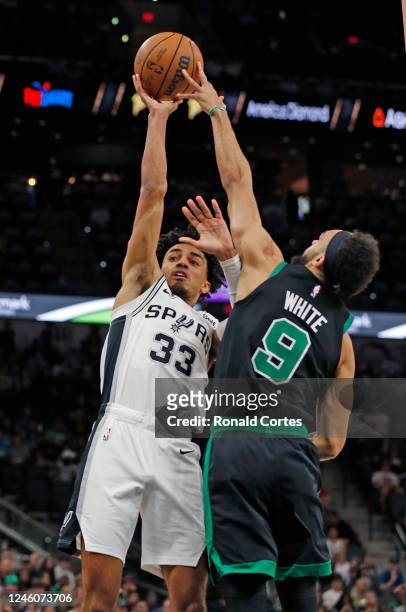 Tre Jones of the San Antonio Spurs has his shot blocked by Derrick White of the Boston Celtics in the first half at AT&T Center on January 7, 2023 in...